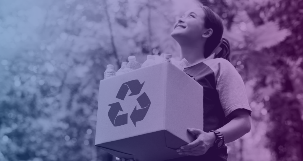 A woman holding a box of recyclables helping to keep production sustainable. 